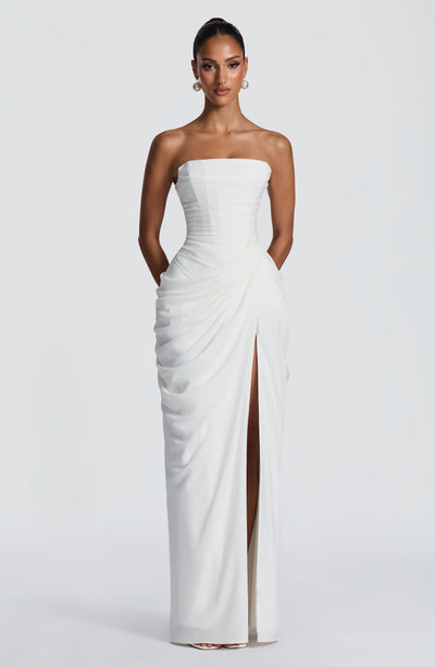 White strapless ruched maxi dress with corset bodice and high front slit, full length
