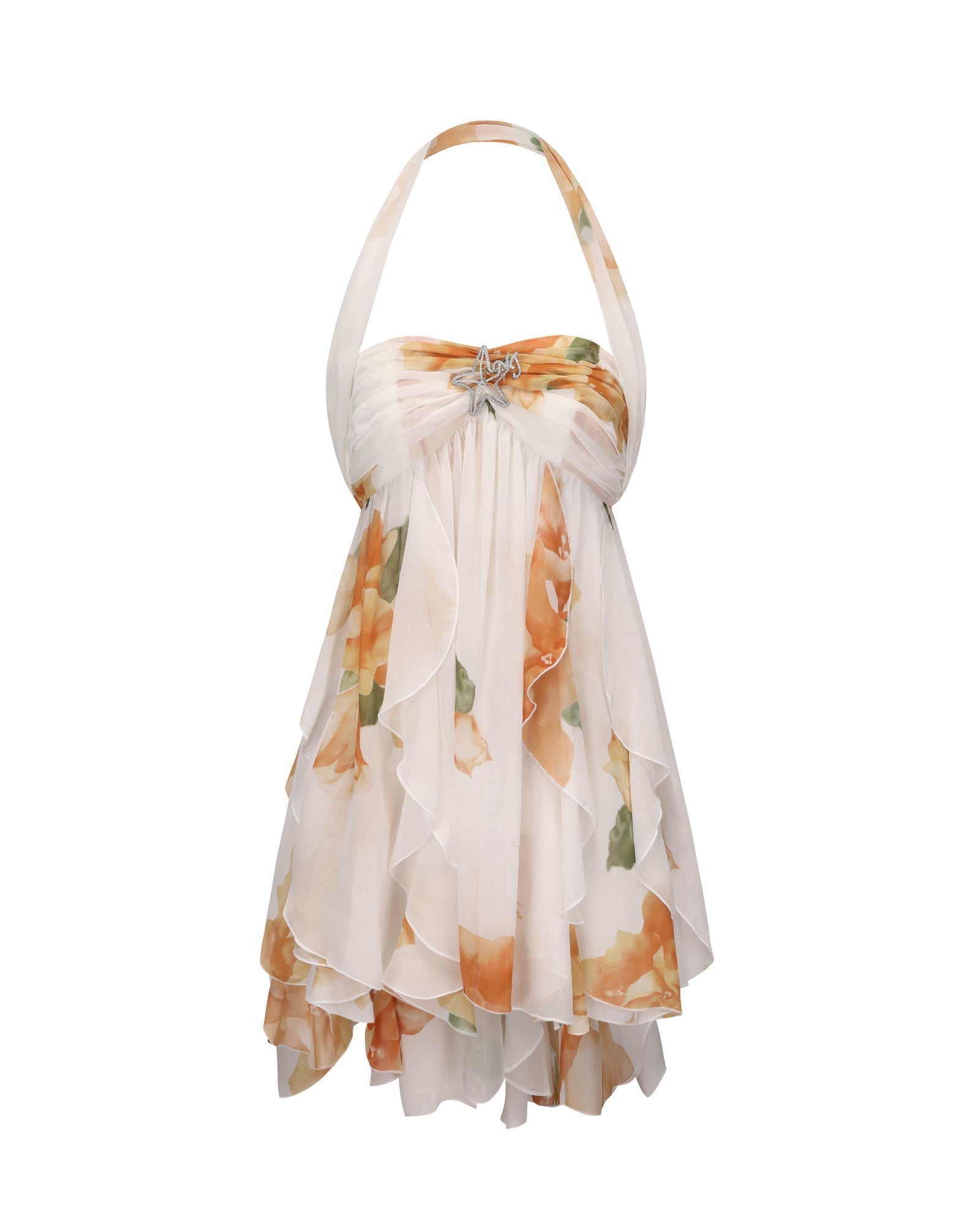 Studio shot of a white Maeve Ruffle Mini Dress with orange floral print, halter neck, and a star brooch accent.
