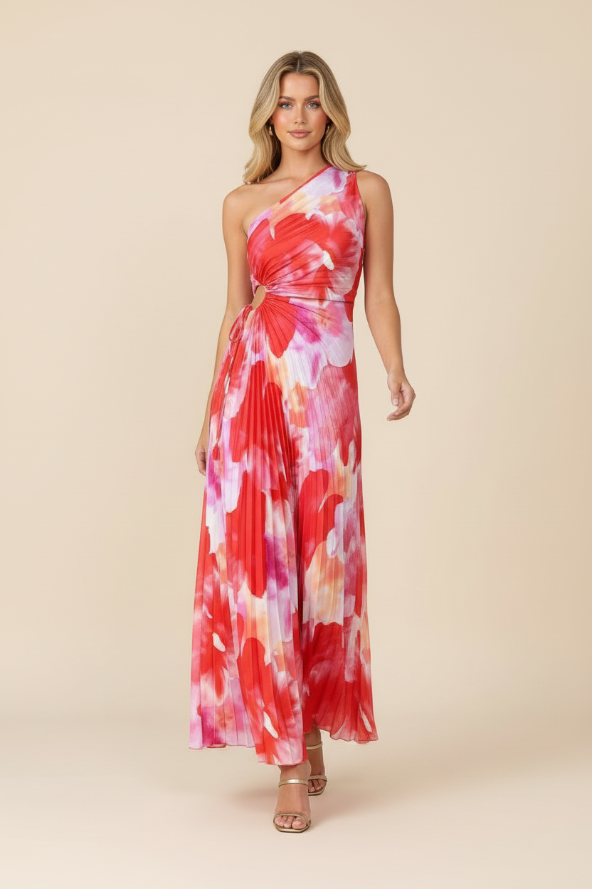 Women's pleated red and pink abstract maxi dress with one shoulder and waist cutout, walking pose