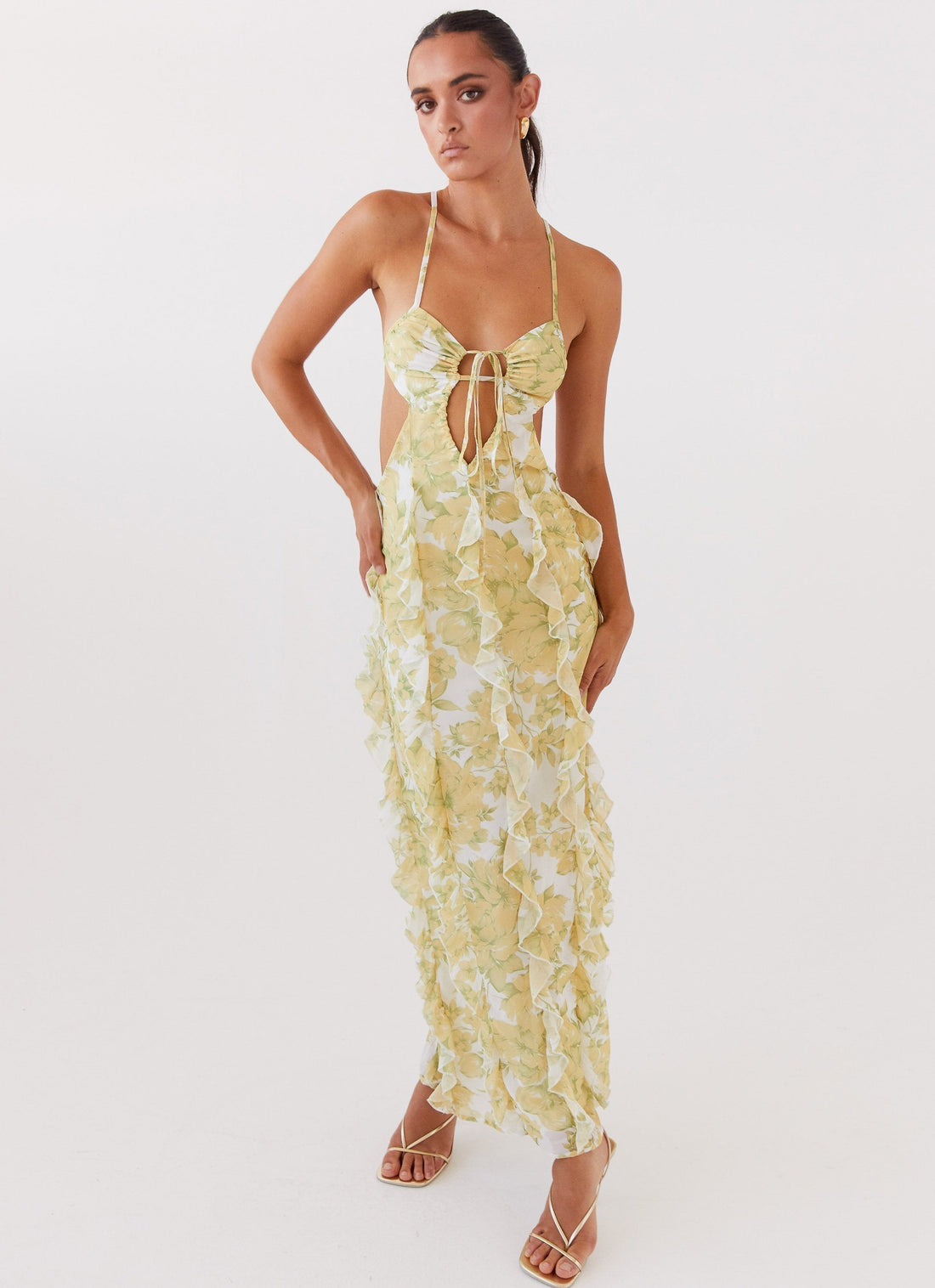 White and yellow floral ruffled maxi dress with a halter neckline and front tie detail for women