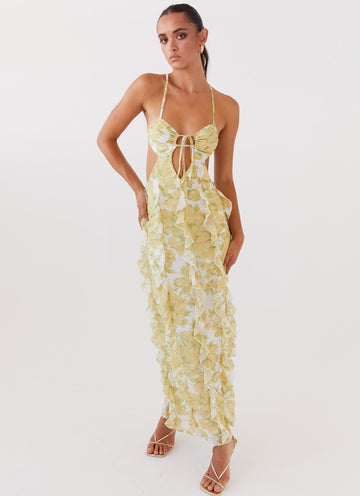 White and yellow floral ruffled maxi dress with a halter neckline and front tie detail for women