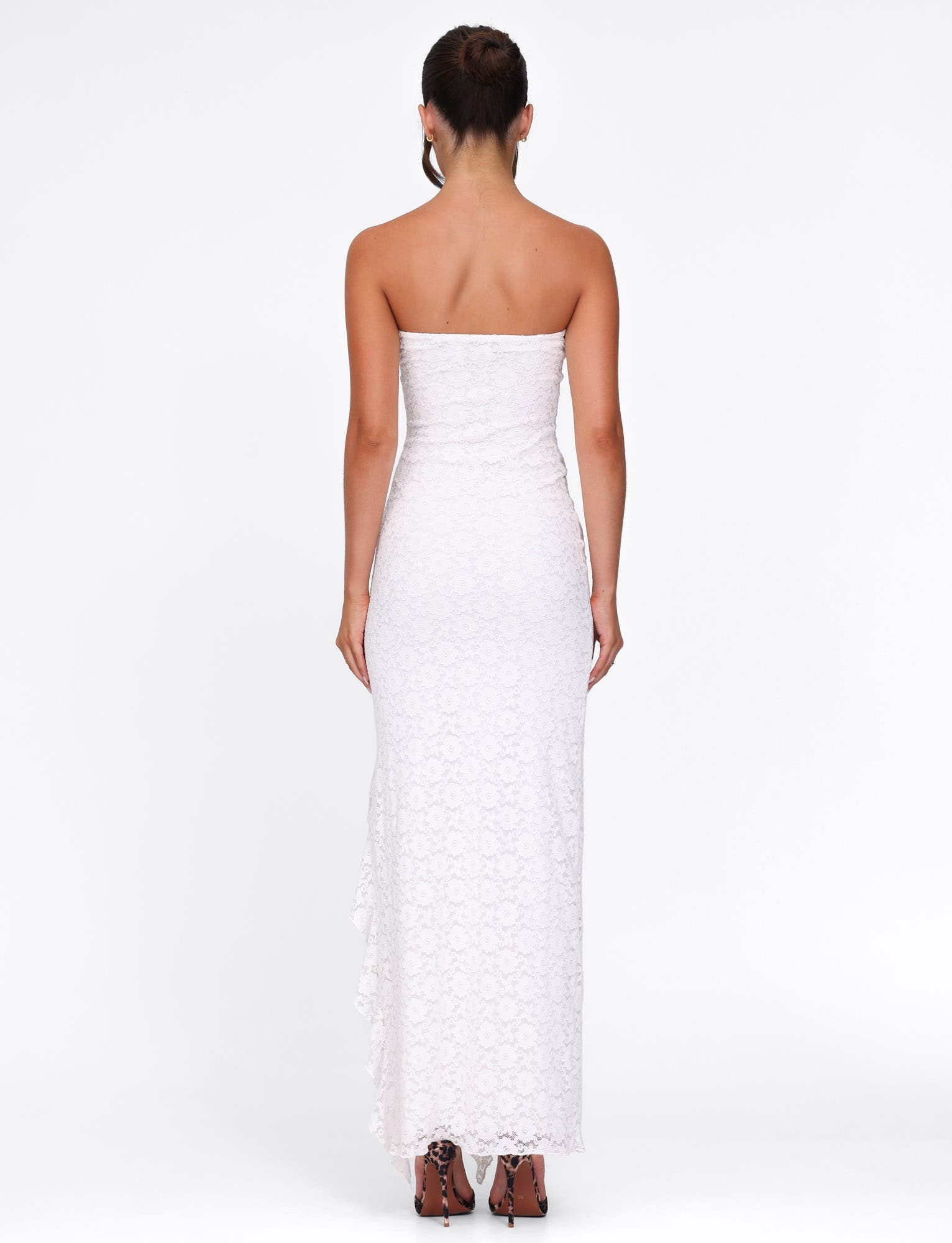 Back view of a white lace strapless maxi dress, showing the full length and delicate lace pattern.