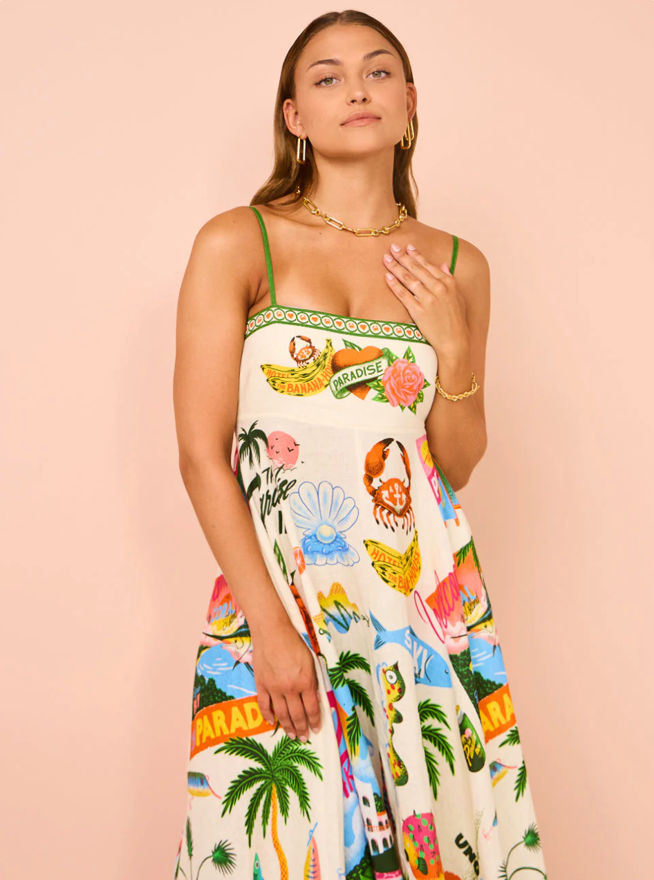 Close-up front view of the bodice and upper skirt of the white tropical maxi dress, showing the detailed resort print.