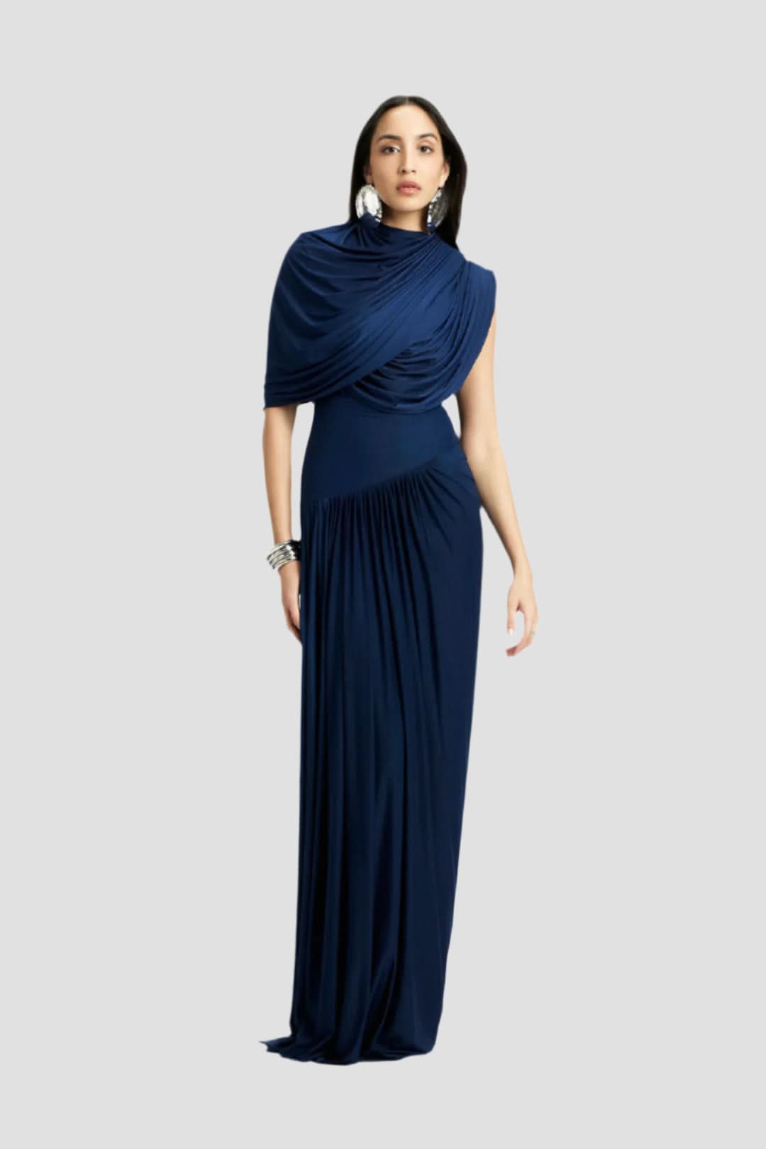 Front view of a dark navy blue Mira Draped Maxi Dress, highlighting the unique shoulder and waist pleat design.