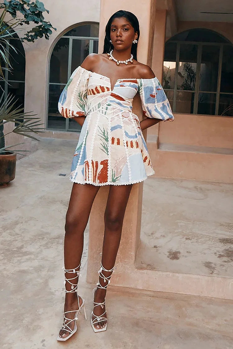 Full body shot of a woman wearing a patchwork off-shoulder mini dress with puff sleeves and strappy heels.