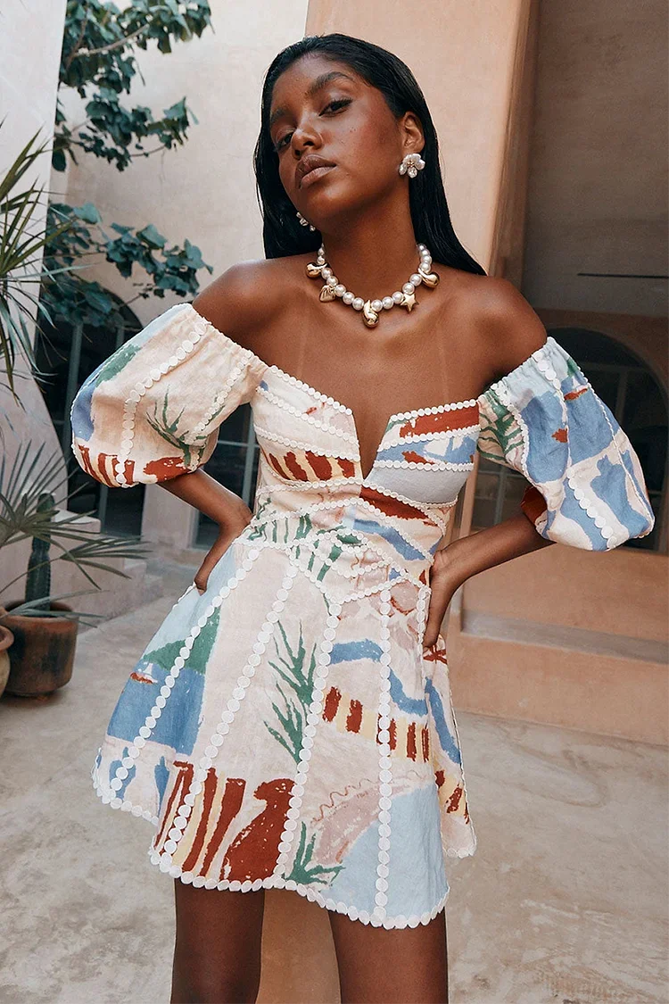 Multi-colored patchwork mini dress with off-shoulder neckline and puff sleeves for women, front view.