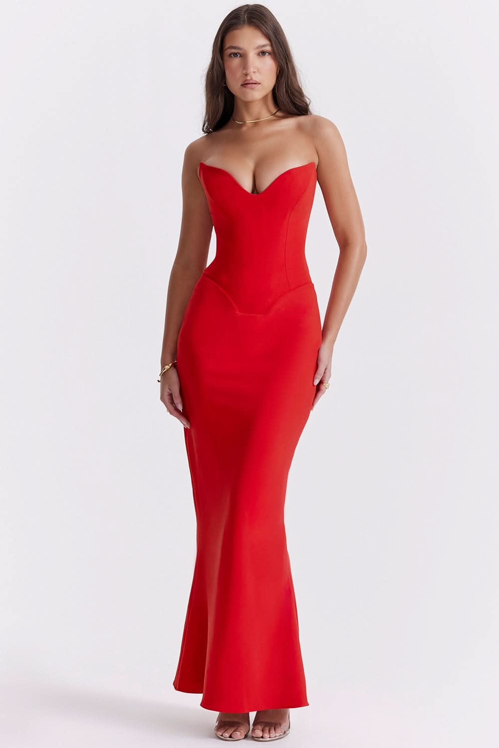 Front view of a striking red strapless corset maxi dress, featuring a sweetheart neckline and a long, sleek skirt.