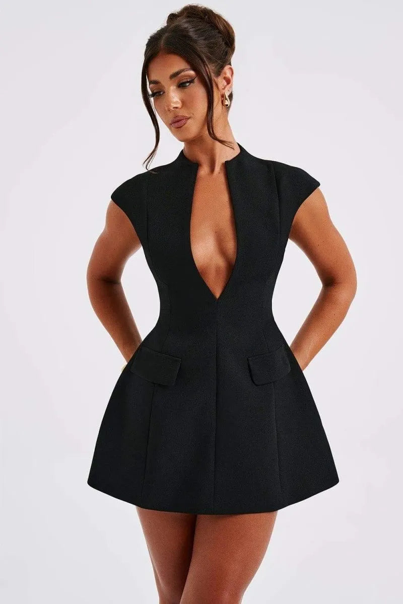 Woman modeling a black tailored mini dress with deep V-neckline and functional pockets for women.