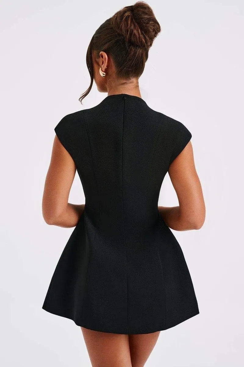 Back view of a black tailored mini dress with high neckline and fitted silhouette for women.