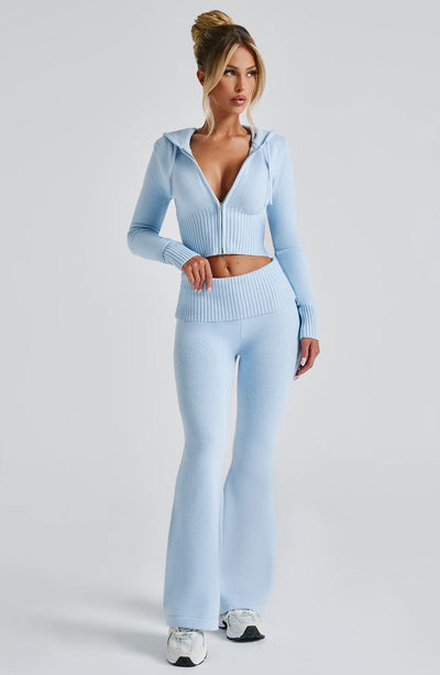 Light blue casual lounge set for women, showing a cropped zip-up hoodie and matching flared pants with a ribbed waist.