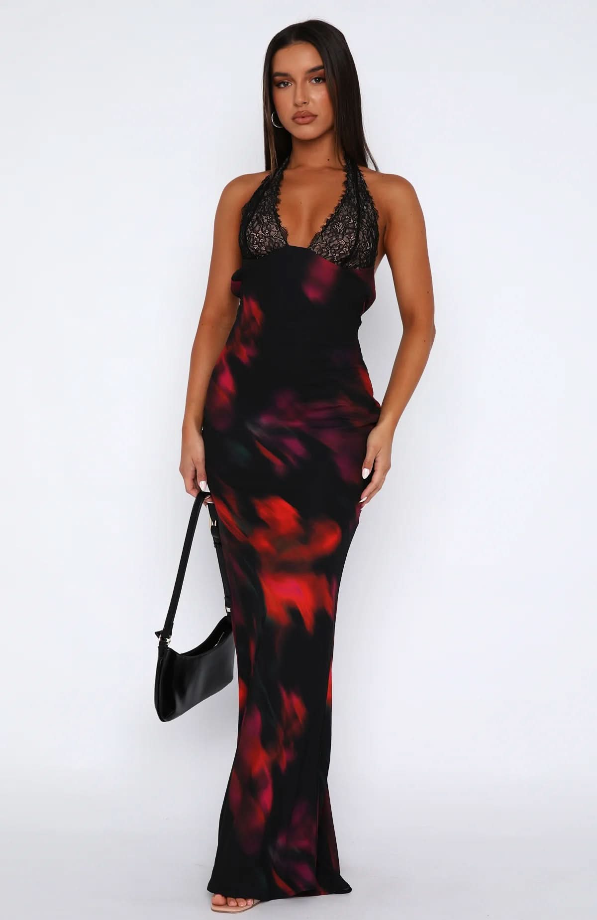 Front view of multi-color abstract print maxi dress with black lace bust on model for women