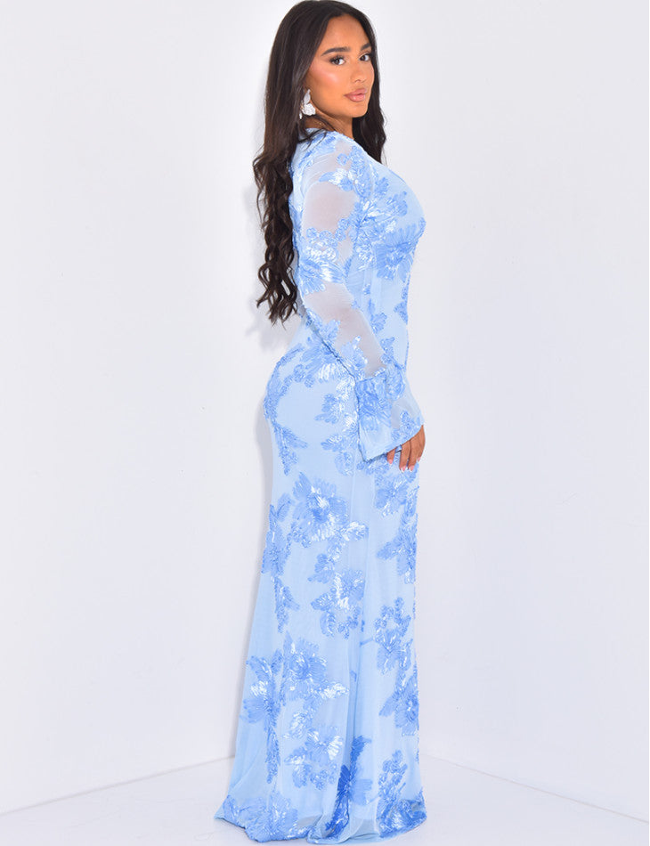 Side profile of the light blue Norah embroidered maxi dress, highlighting the fitted silhouette and long sheer sleeves with flared cuffs.