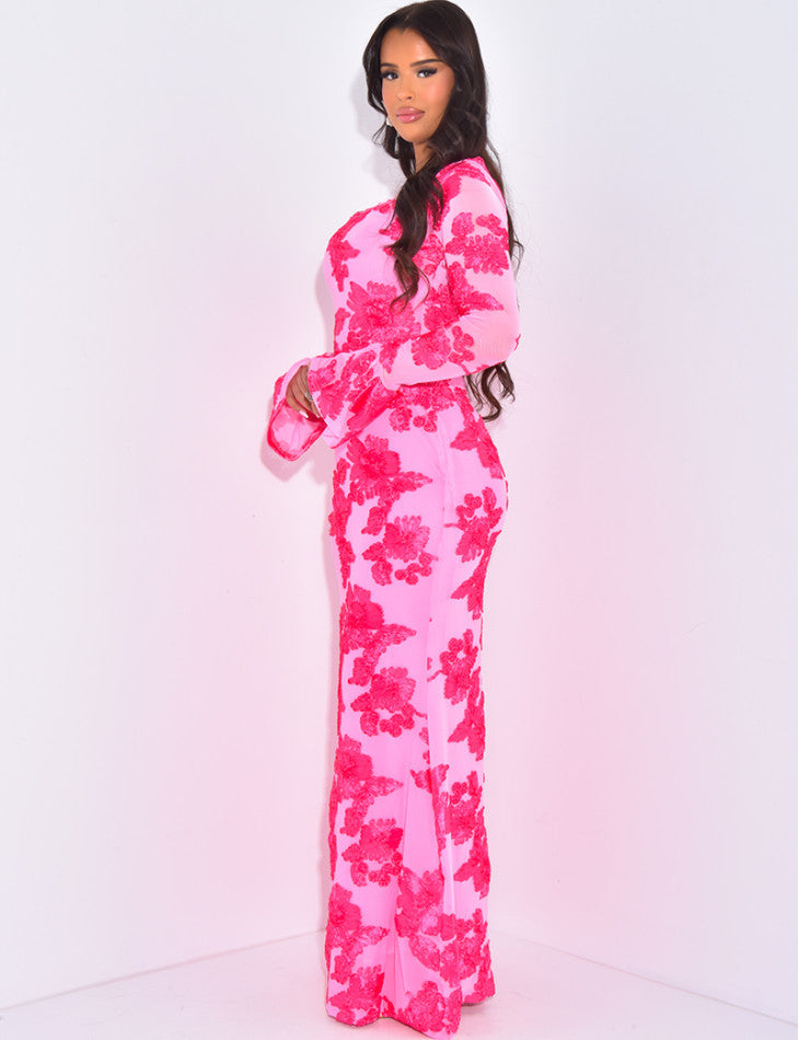 Side profile of the bright pink Norah embroidered maxi dress, showcasing the vibrant floral sequins and long sheer sleeves.