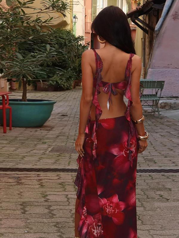 Back view of the red floral tie-back crop top and long flowing maxi skirt, showing the open back design and print.