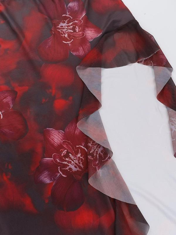 Fabric swatch close-up of the red floral print on the maxi dress material, showing the sheer ruffle trim.