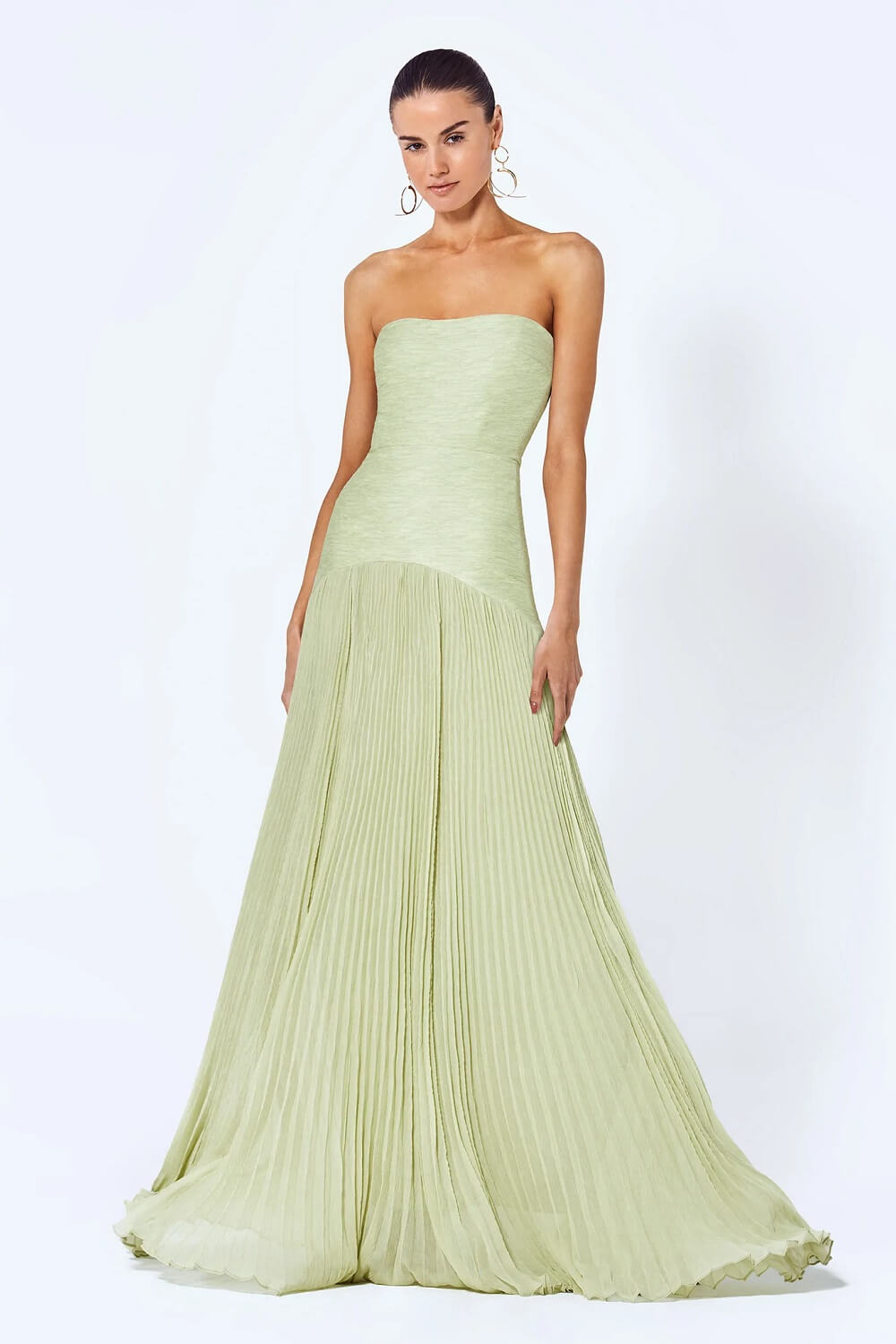 Light green strapless pleated maxi dress with a fitted bodice and full skirt for women, front view.