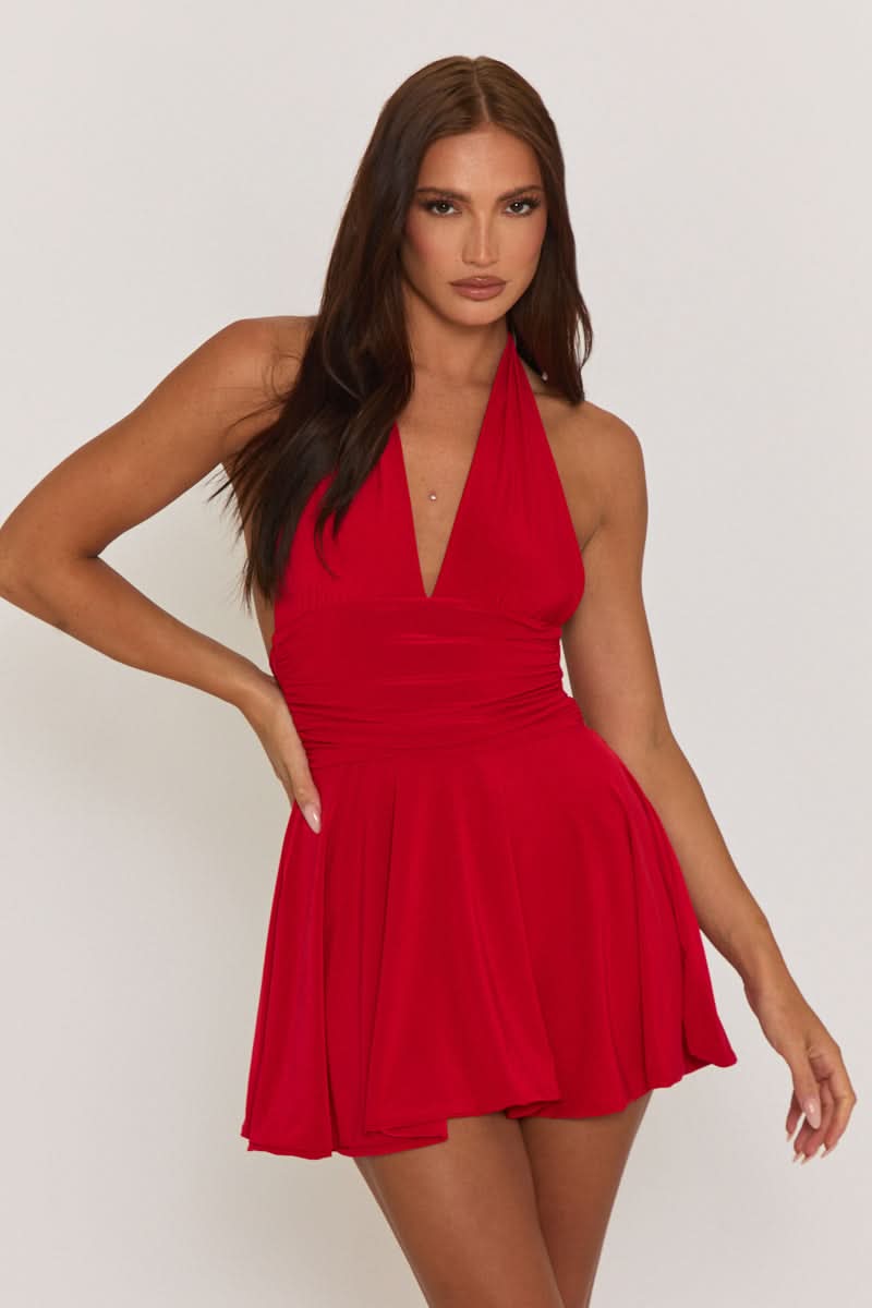 Front close-up of the red halter mini dress, highlighting the plunging neckline and ruched waist.