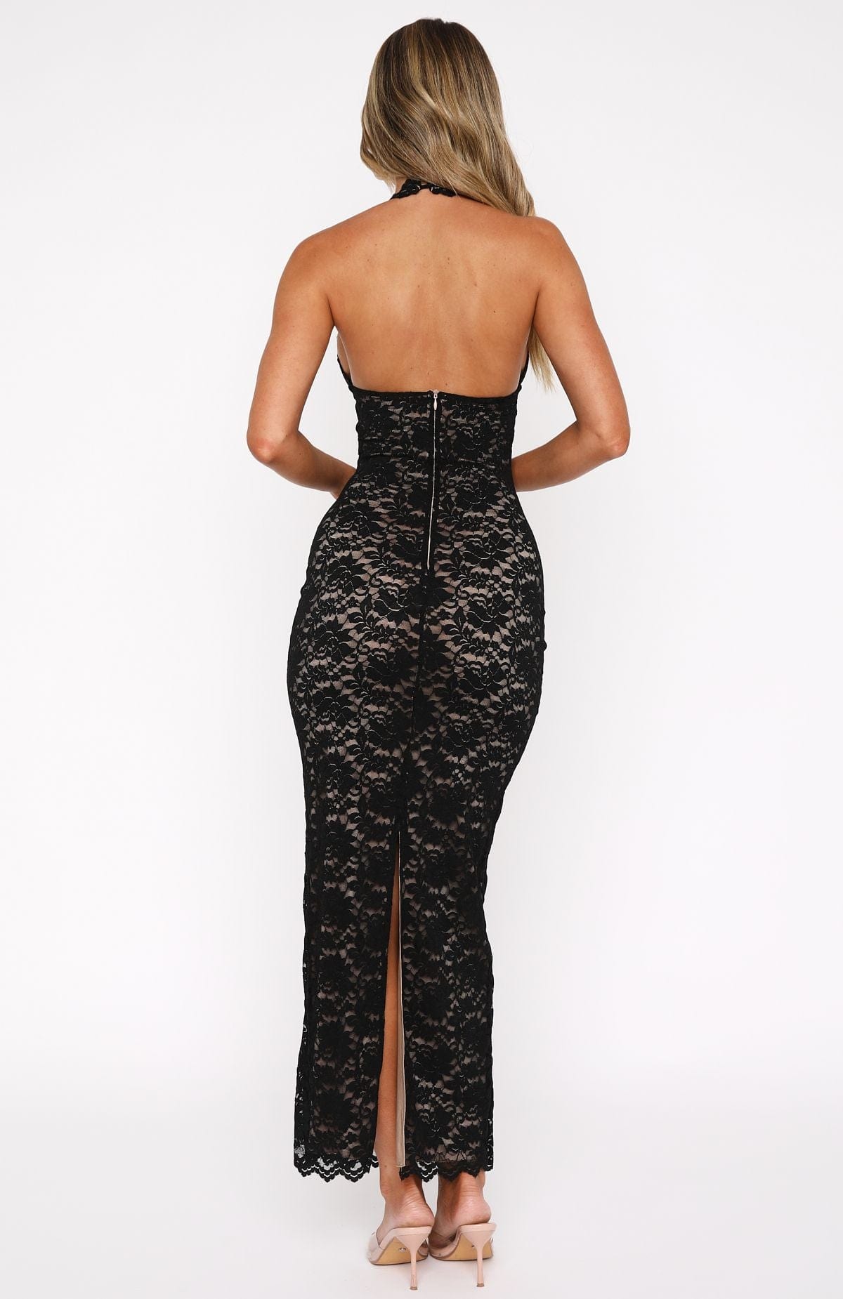 Back view of black lace maxi dress with a zipper and backless detail, form-fitting for women.