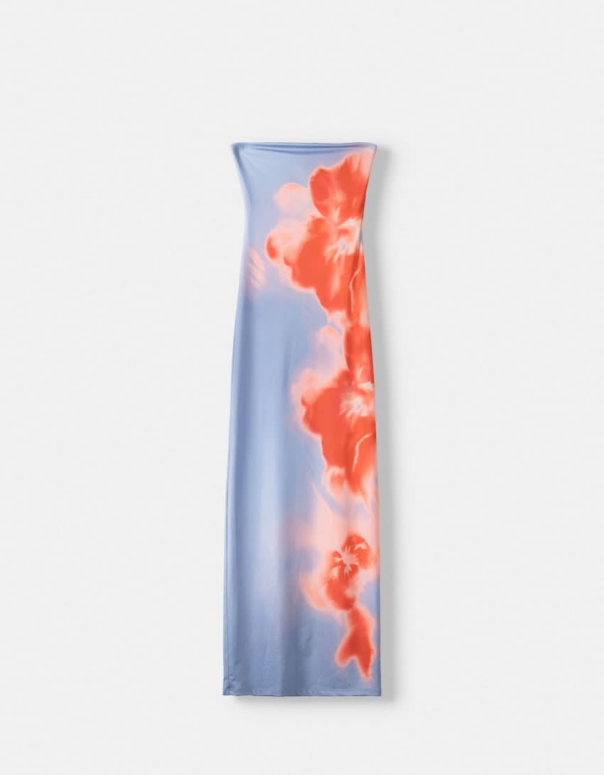 Flat lay of the blue strapless maxi dress featuring the full blurred orange floral print design.