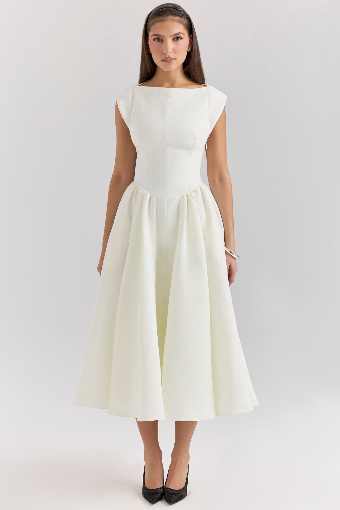 Front view of the white Sara open-back midi dress with boat neck and full skirt, elegant for special occasions.
