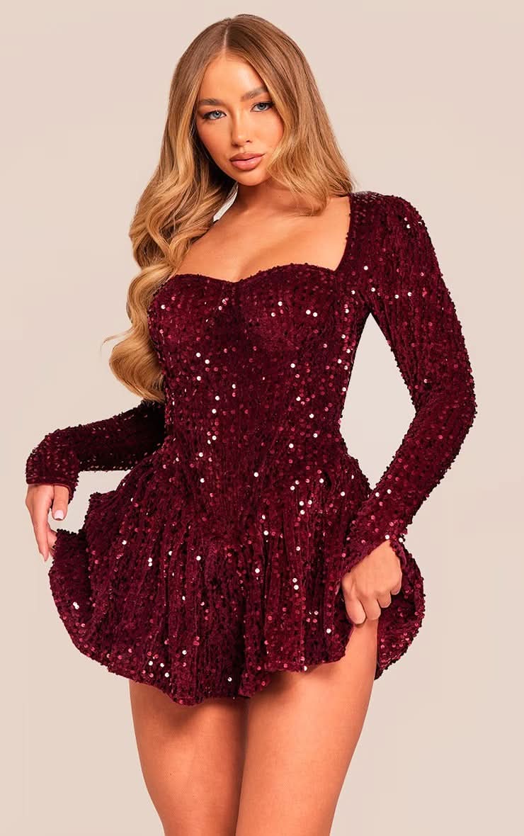 Front view of a burgundy sequin mini dress, highlighting the sweetheart neckline and shimmering sequin texture.