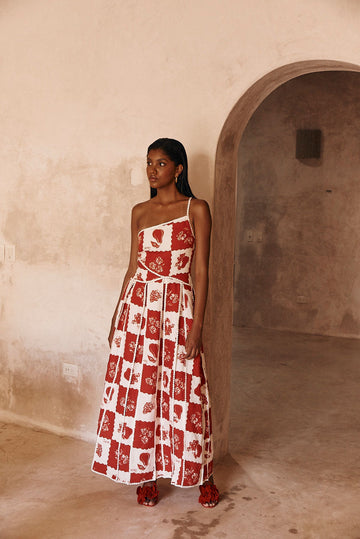 Savannah one-shoulder maxi dress in red and white checkered print with scalloped trim, full length.