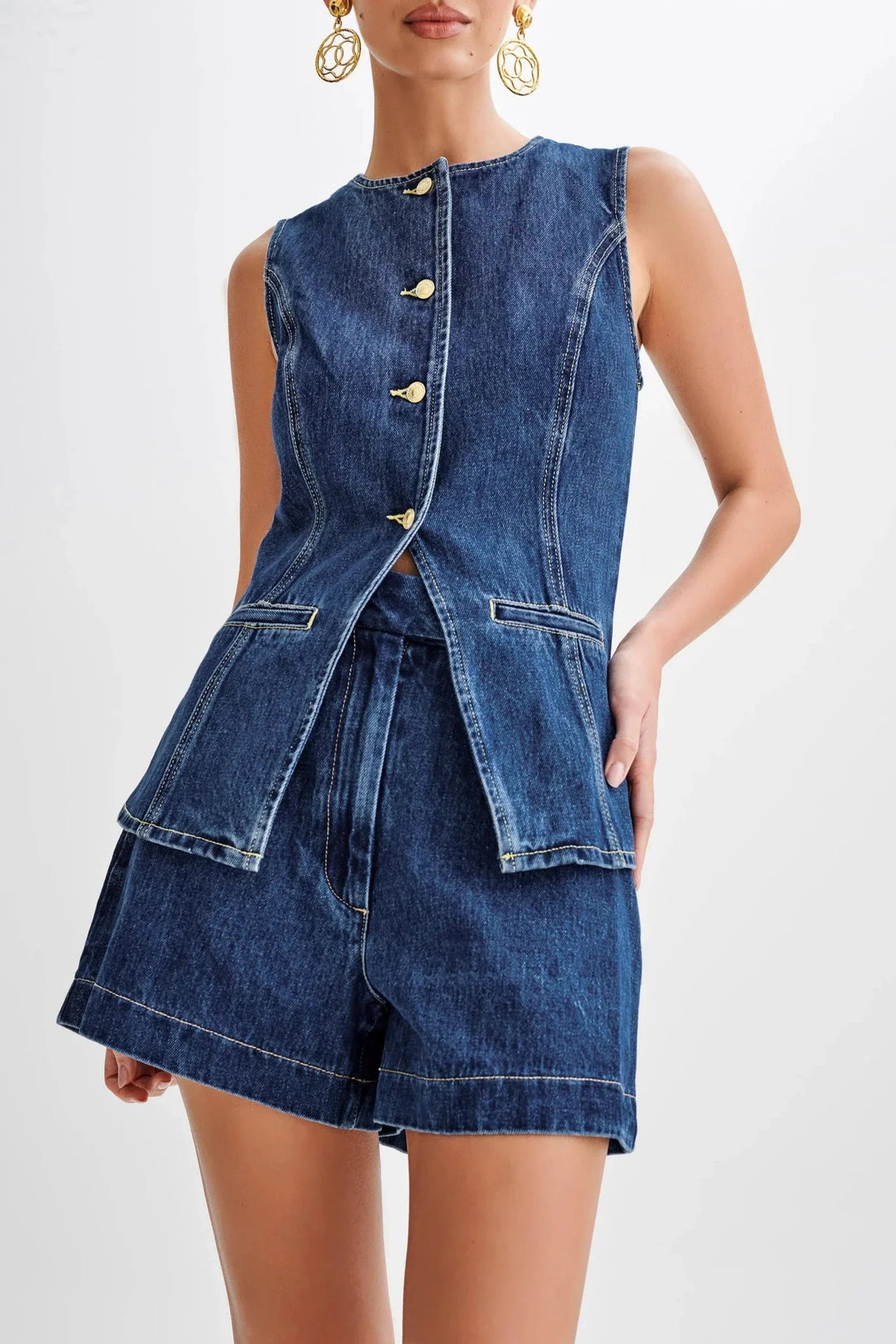 Sleeveless denim button-up top with gold buttons and matching high-waisted shorts, forming a chic pant suit for women.
