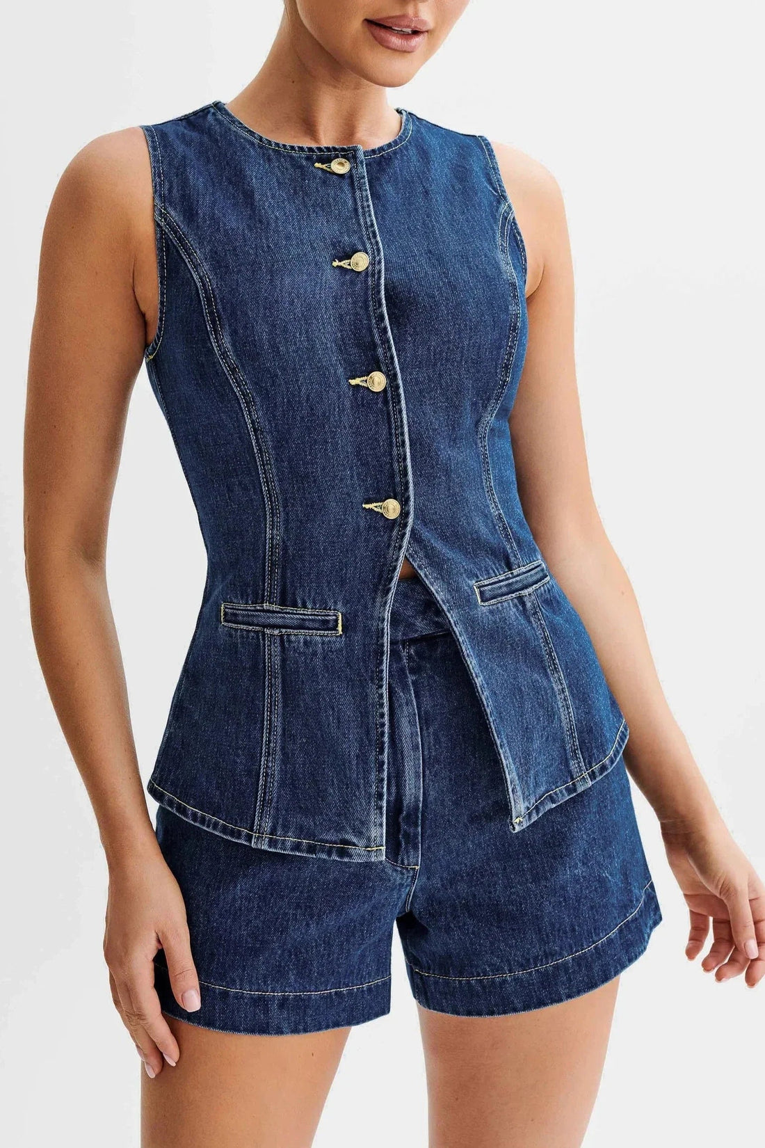 Sleeveless denim button-up top with gold buttons and matching high-waisted shorts, forming a chic pant suit for women.