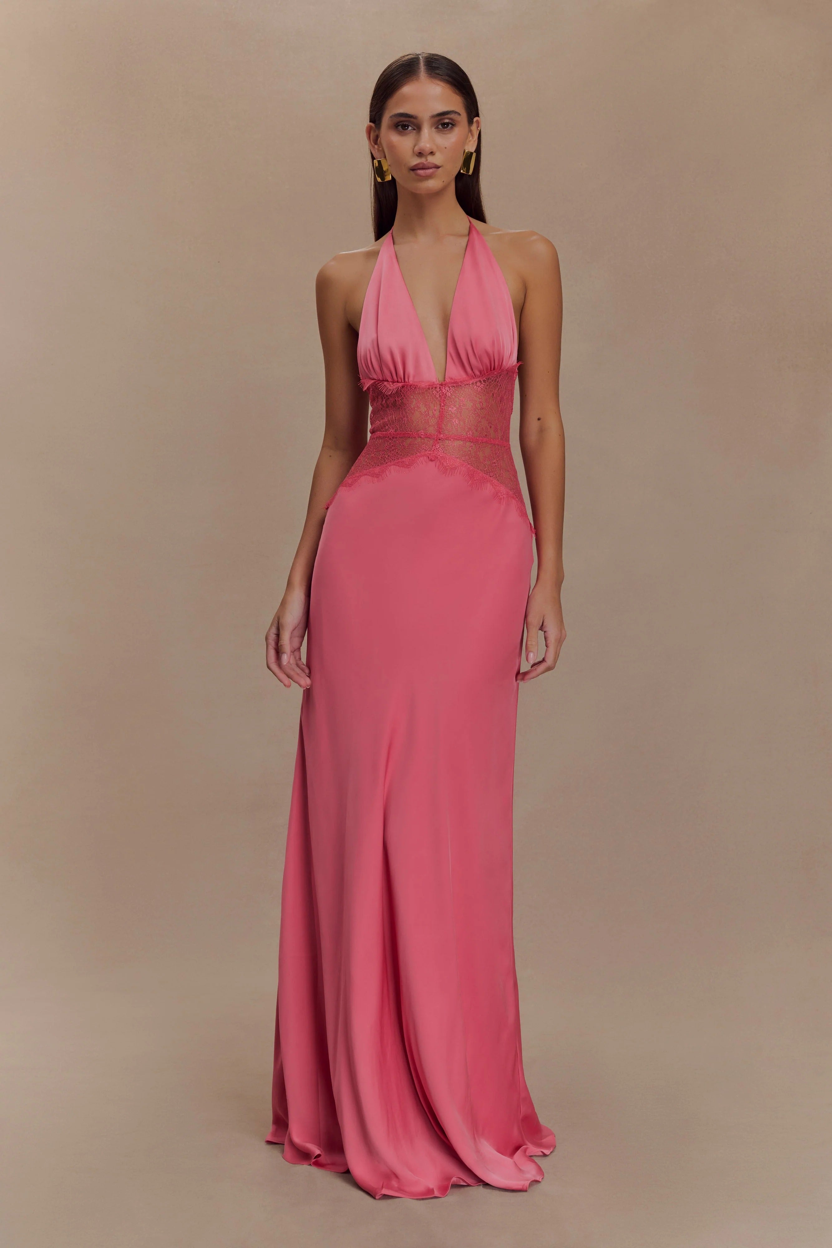 Vibrant pink Skye Lace Maxi Dress with a plunging V-neck halter and matching pink lace paneling on the midriff.