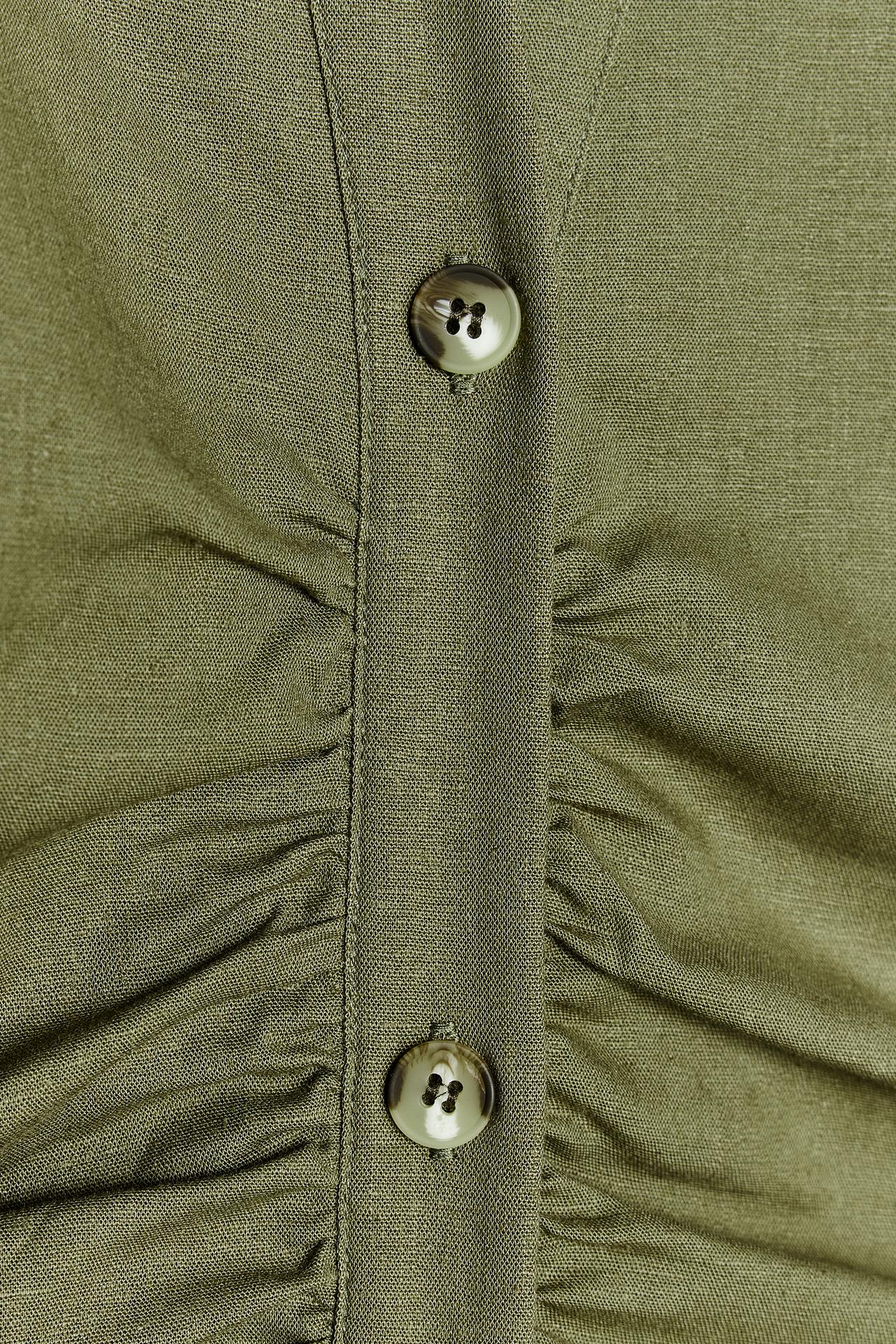 Close-up of the olive green Sofia Button Midi Dress fabric, highlighting the textured material and the two light brown buttons on the ruched placket.