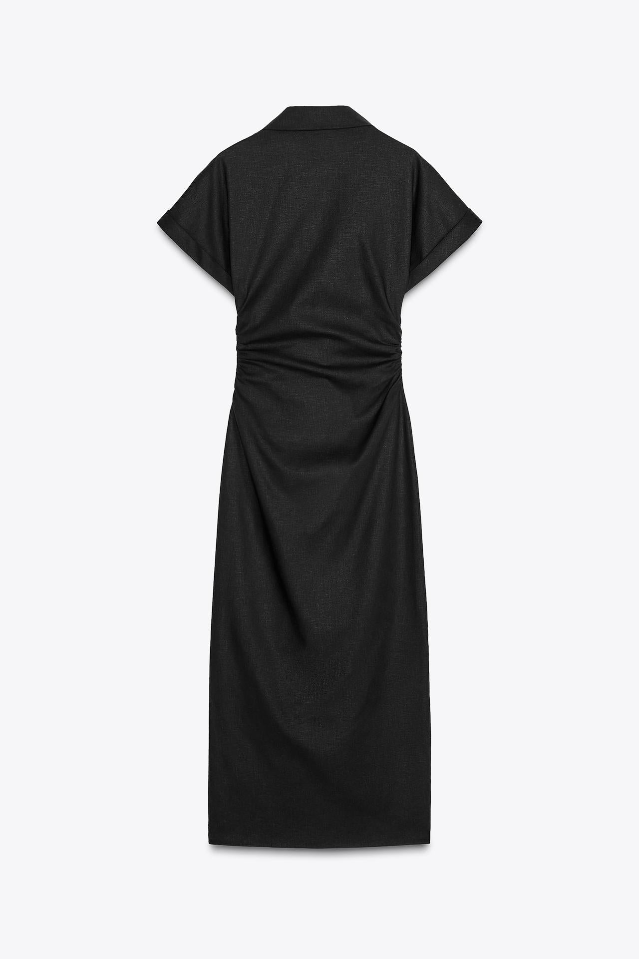 Back view of the black Sofia Button Midi Dress, showcasing the elegant drape of the fabric, short cuffed sleeves, and subtle ruched detailing at the waist.