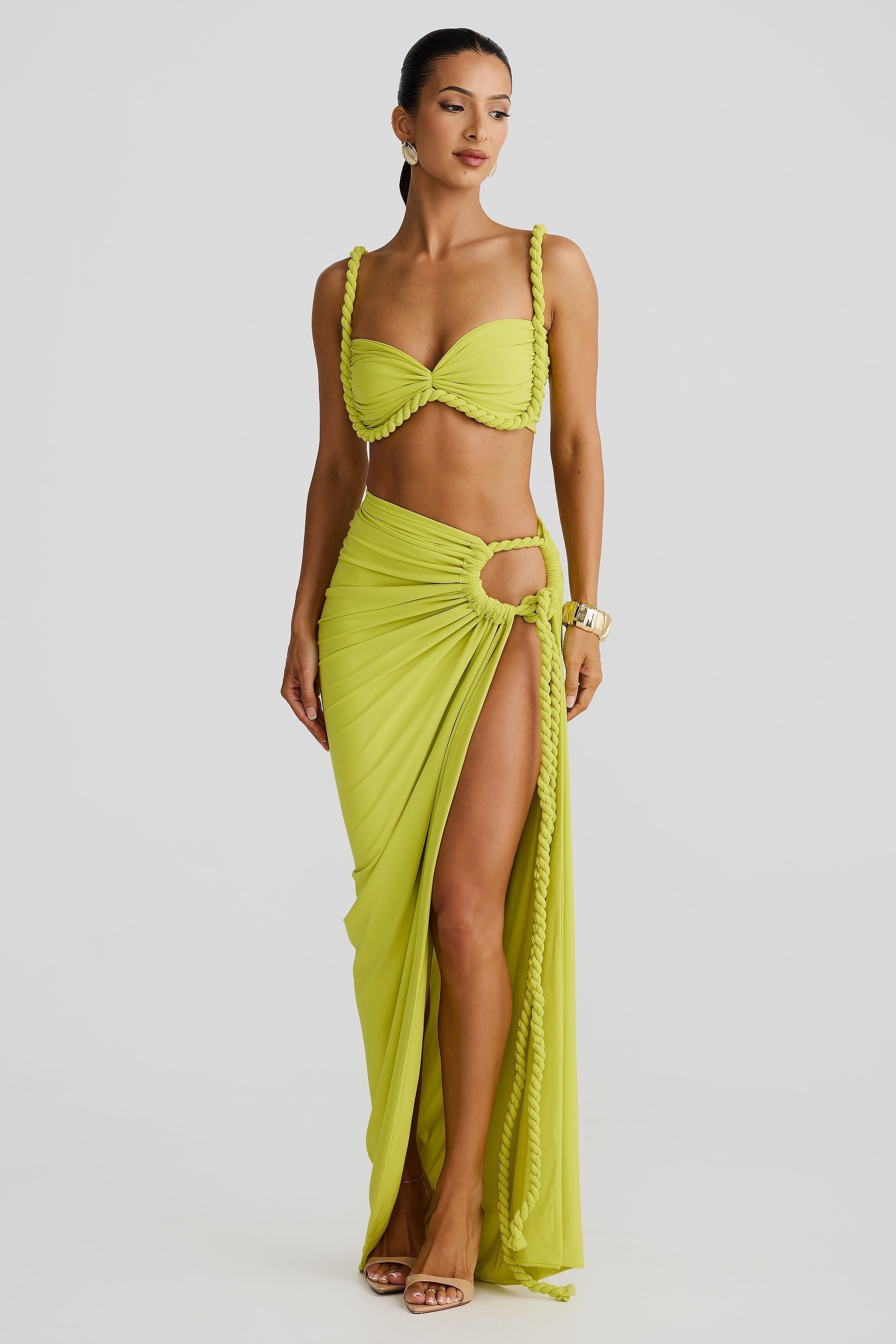 Full view of a lime green Sophie Braided Maxi Set, featuring a braided bikini top and a high-slit maxi skirt with rope accents.
