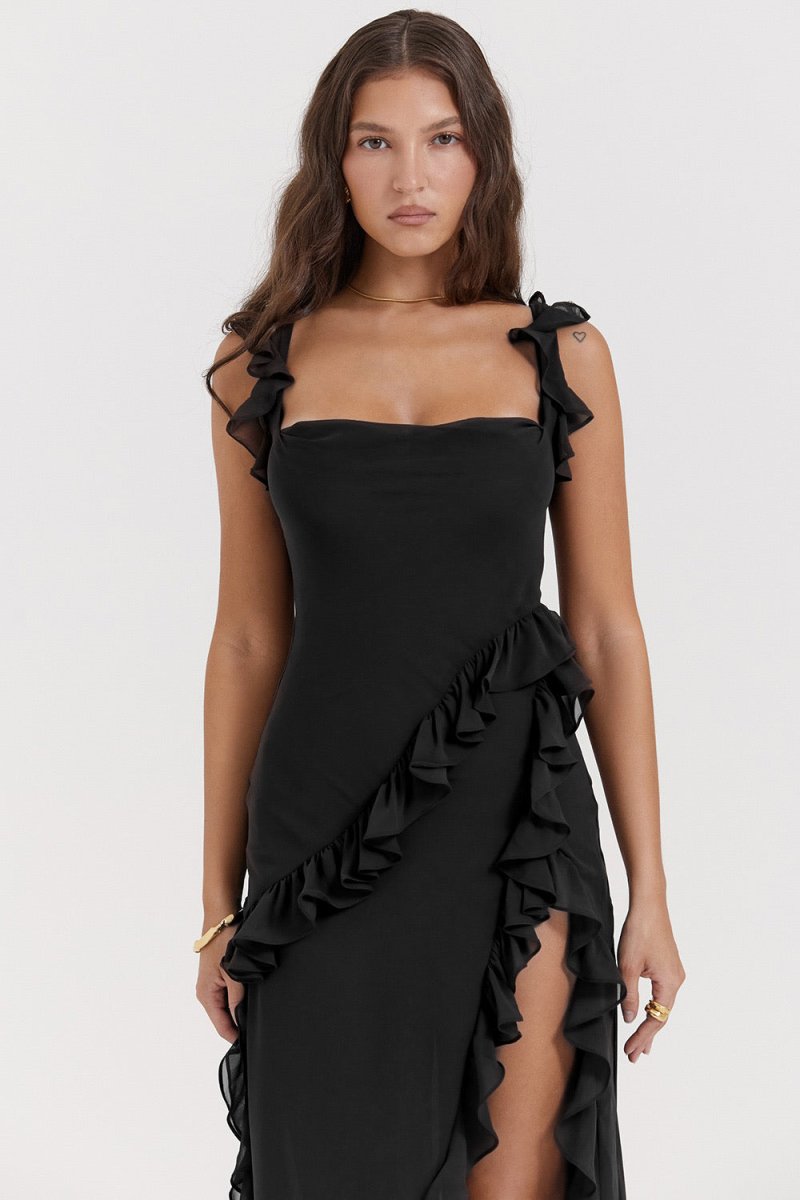 Close-up of the black Sylvia Ruffle Maxi Dress, showing the square neckline, ruffled straps, and side ruffles.