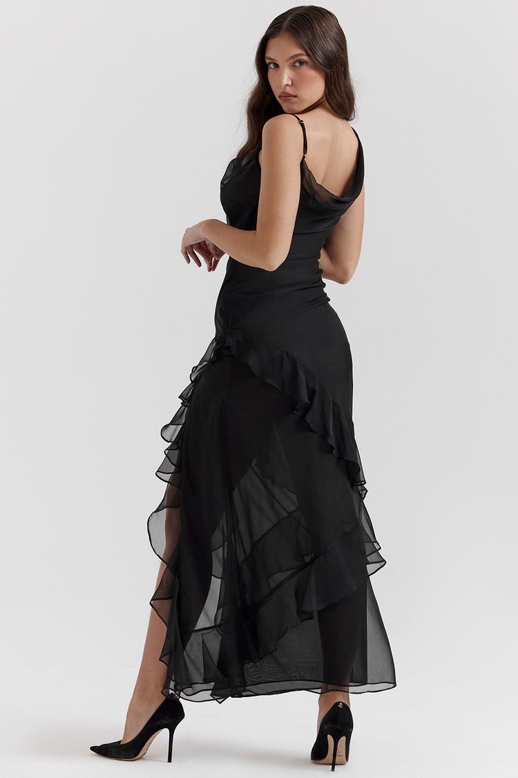 Back view of black Sylvia Ruffle Maxi Dress with sheer fabric and cascading ruffles, high slit, and delicate straps.
