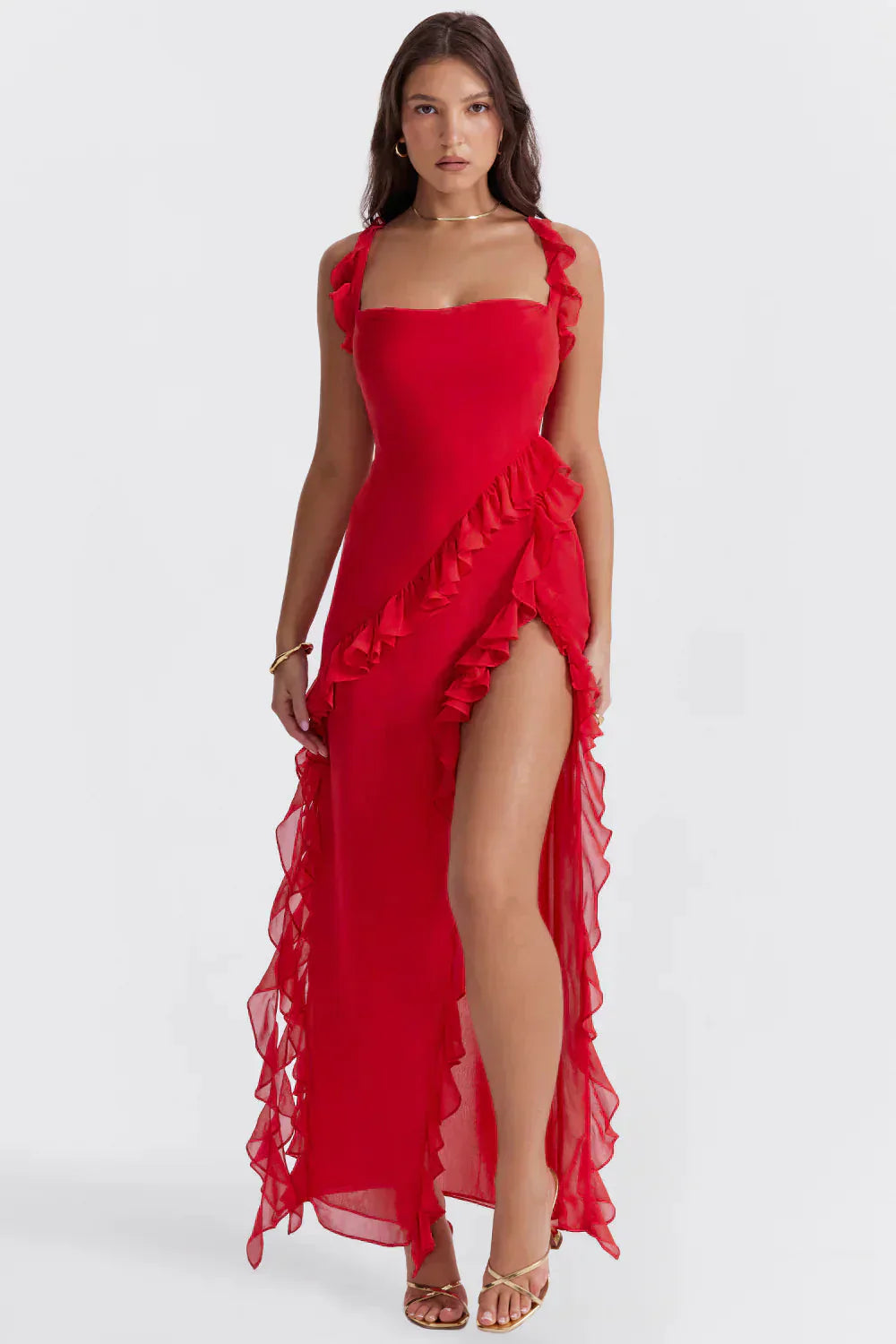 Front view of the red Sylvia Ruffle Maxi Dress, featuring a square neckline, ruffled straps, and a high slit.