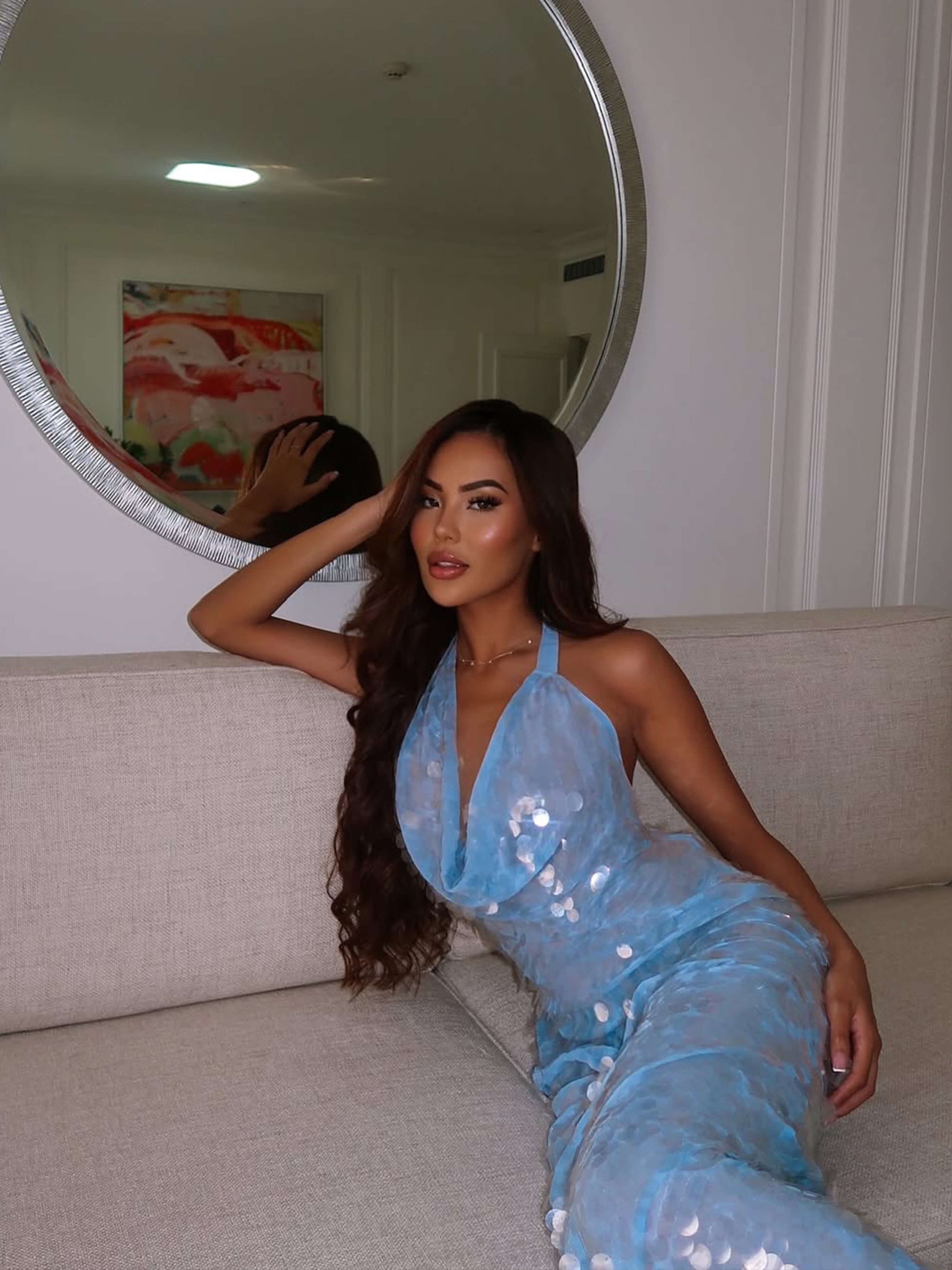 Elegant light blue sequin halter maxi dress with a draped cowl neck, perfect for formal occasions.