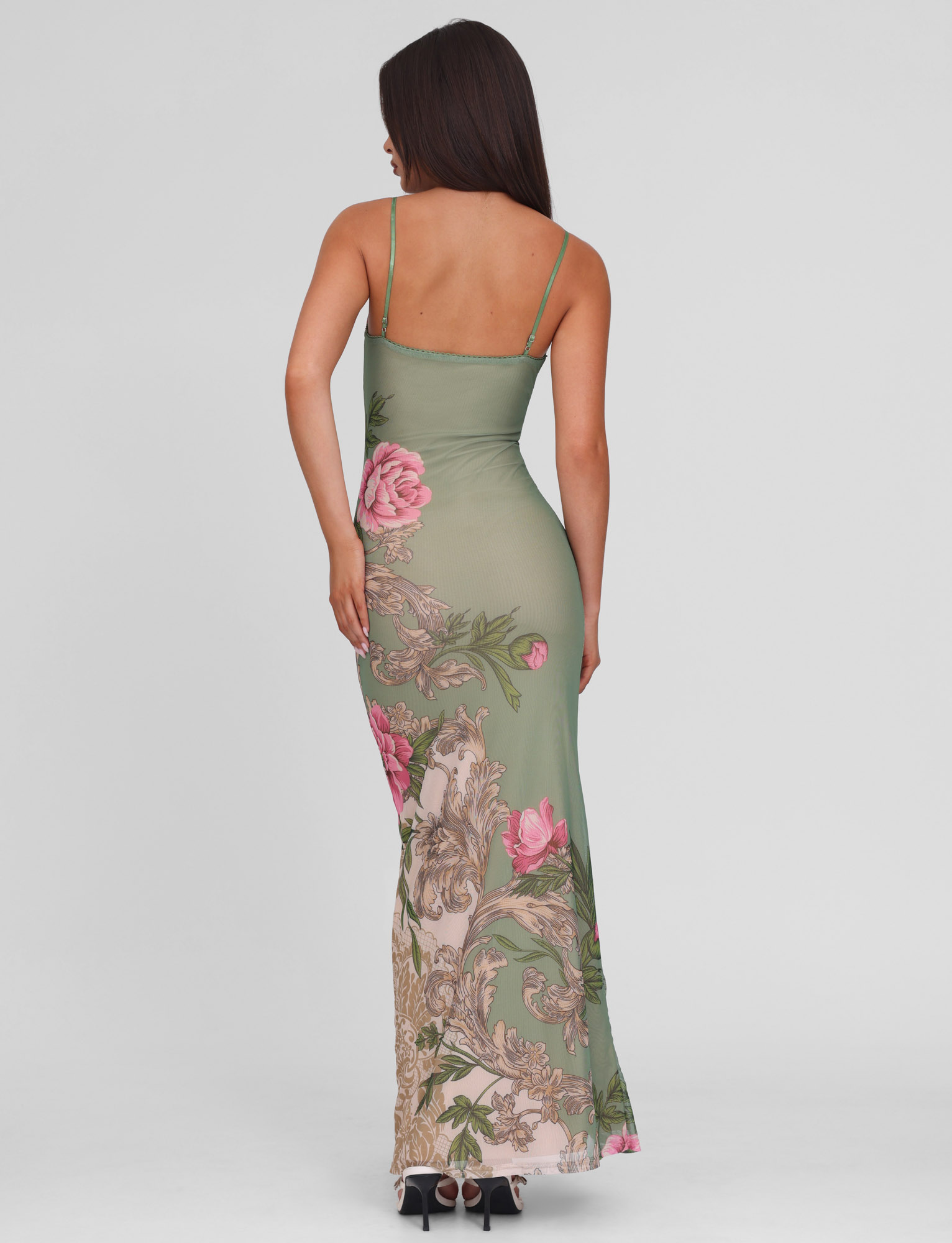 Back view of the Thea Floral Maxi Dress on a model, showcasing the delicate spaghetti straps and flowy silhouette.