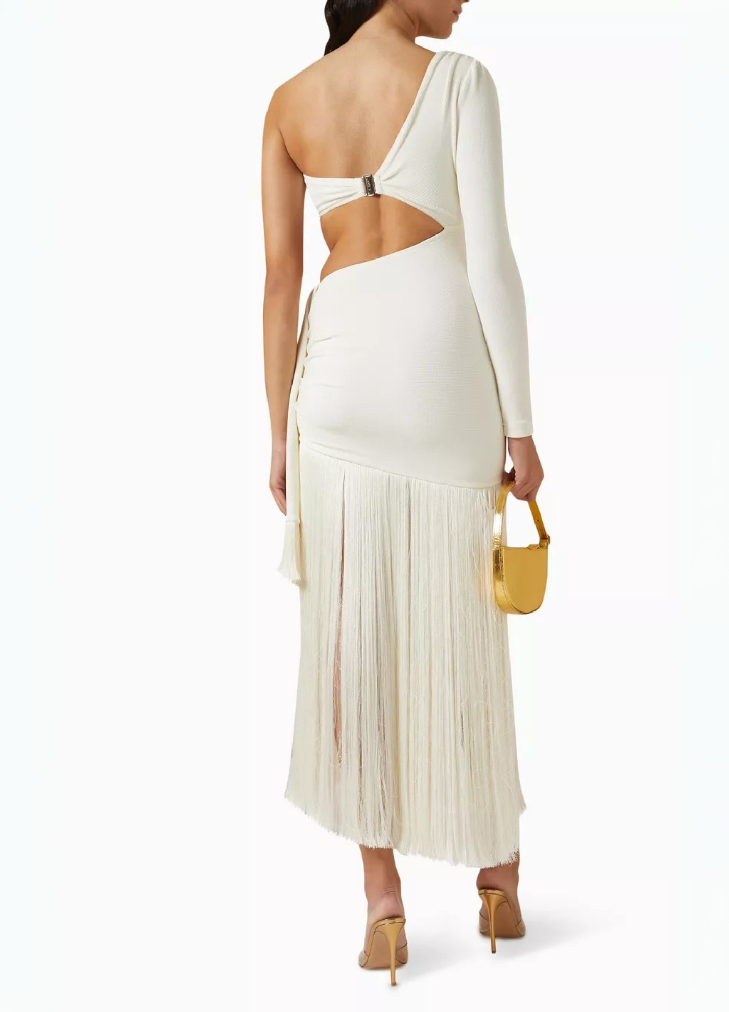 Back view of a white one-shoulder maxi dress with an open back detail, side cutouts, and a long fringe skirt.