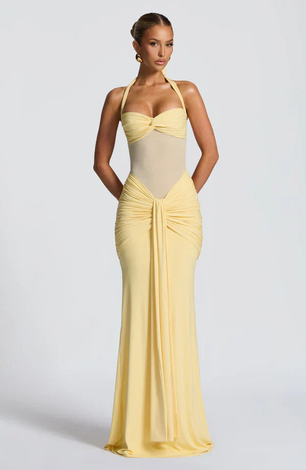 Pale yellow Victoria ruched maxi dress with a halter top and gathered waist detail, a chic suit dress alternative.