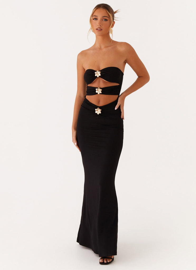 Black strapless Vienna Cutout Maxi Dress with pearl-like floral embellishments on bodice and waist cutouts, front view.