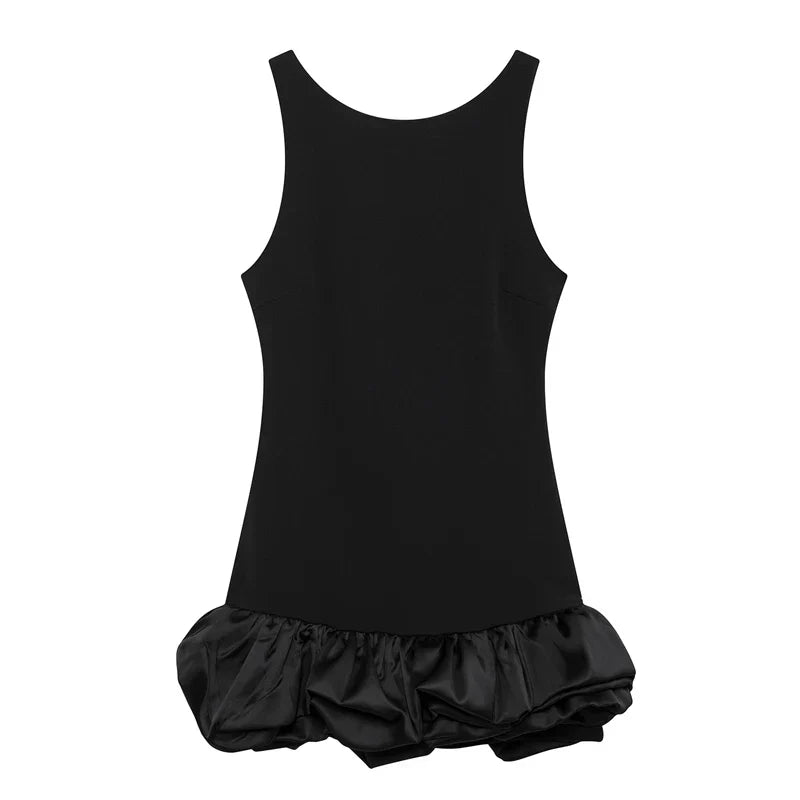 Front view of a chic black Vienna Rosette Mini Dress, showcasing its sleeveless style and ruffled hem.