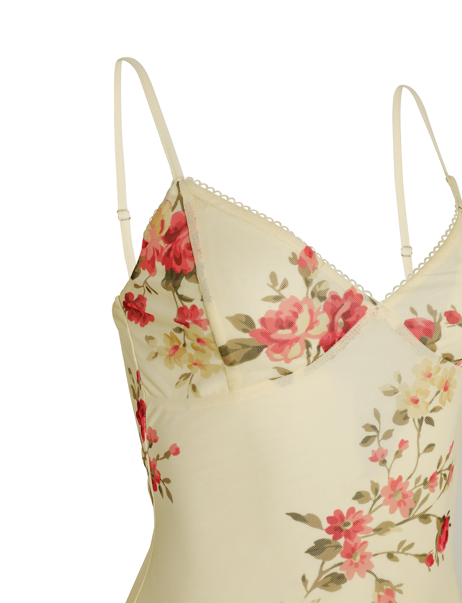Detail shot of the cream floral maxi dress bodice, highlighting the adjustable spaghetti straps and delicate lace trim on the neckline.