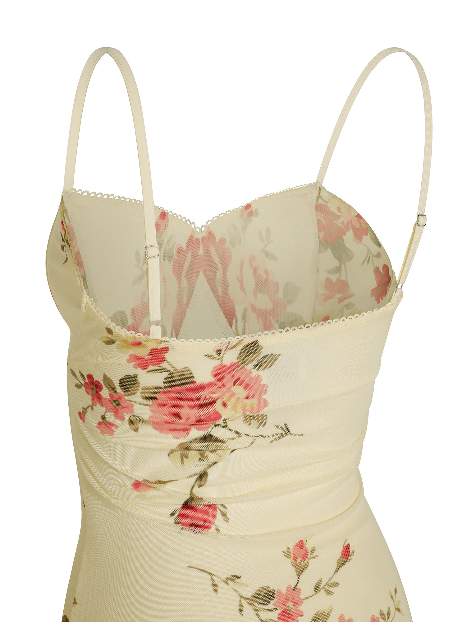 Back view detail of the cream floral maxi dress, showing the adjustable spaghetti straps and ruched back panel with rose print.
